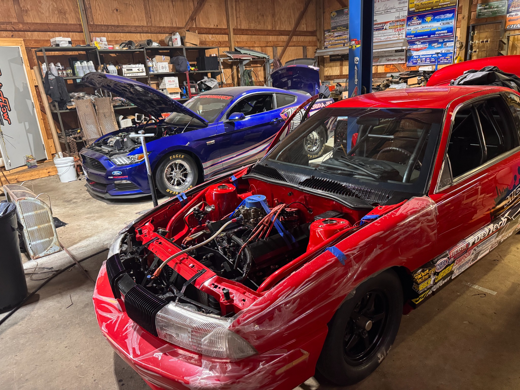 Red M20 race car in the fabrication shop
